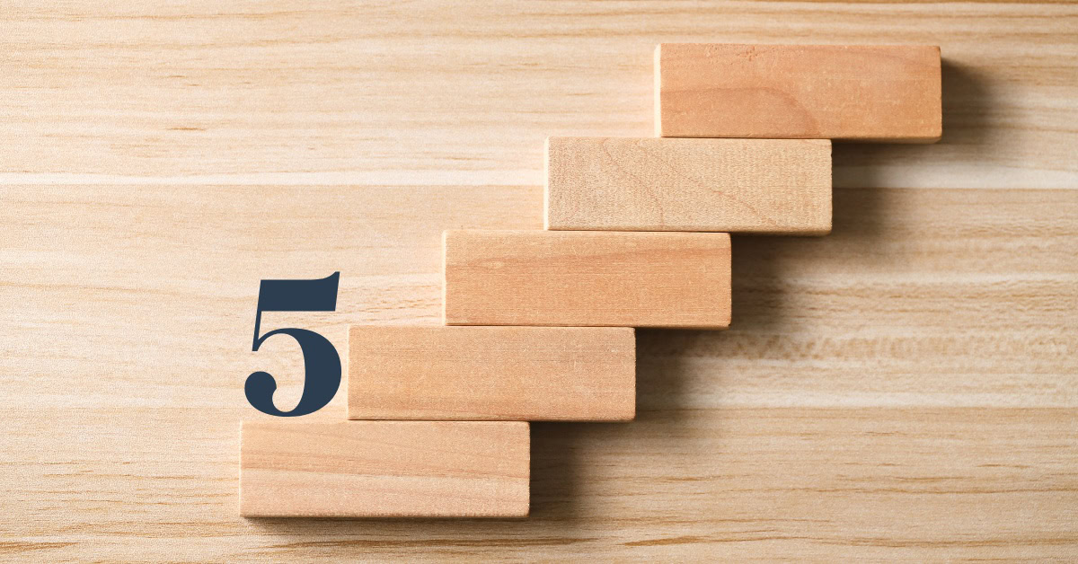 Wooden blocks arranged like steps with a navy number 5, symbolizing five steps to building a brand with logo, website, and online presence.
